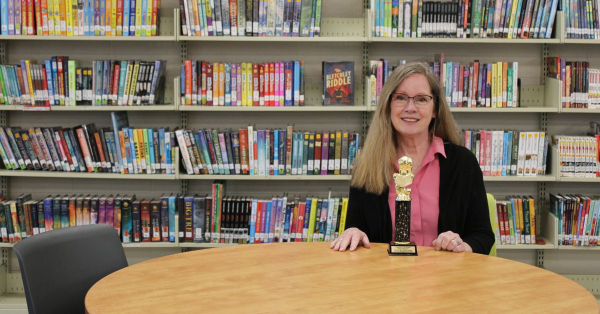 librarian with trophy